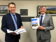 Jon Gibbons with Mayor Greg Christensen and Council’s 2020-21 Annual Report. Photo: Scenic Rim Regional Council.