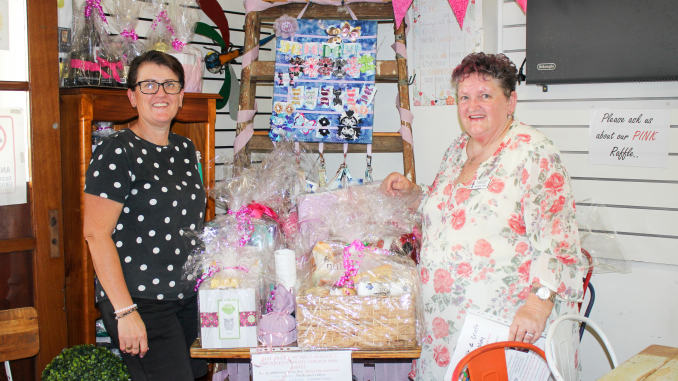 Bean To owner, Kylie Peterson with Kerrie Wise from Cancer Council Beaudesert Branch and the many raffle prizes donated by local businesses.