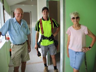 Committee members Gordon Evans and Lani Deeran with local builder Sam Nichols (centre) working on the renovations.