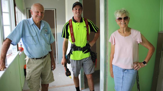 Committee members Gordon Evans and Lani Deeran with local builder Sam Nichols (centre) working on the renovations.