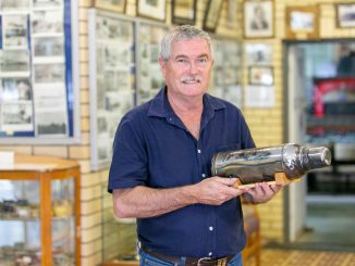 Beaudesert Historical Society President, Mark Plunkett with the thermos which was instrumental in keeping the Stinson crash survivors alive.
