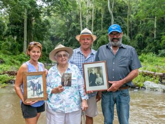 Dinah Buchanan (second from left) with daughter Diane Ardrey and sons Ray and Paul Buchanan, hold portraits of Roy, John and JT Buchanan (JT pictured in portrait with wife Marie).