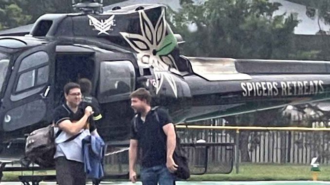 Doctors Brendon Evans and David Barker arrive at Beaudesert Hospital by helicopter. Image supplied.