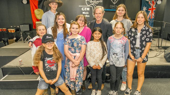 Rick Price (centre back) with GTM Music Studios' students who attended the performance and singing masterclass