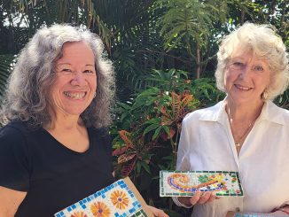 Tina Jones and Rosie Malady with four of the Beaudesert mosaic contributions. Image supplied.