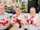 Vicki McAteer (centre) from Beaudesert's Christmas Spirit Committee delivers Santa to Ken Wright and Trish Ryan from Wright's Jewellers.