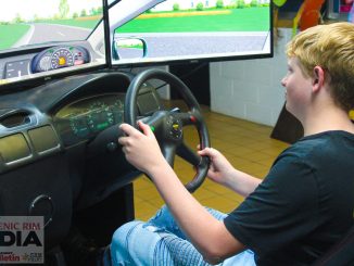 Corey Rooks tries out the driving simulator