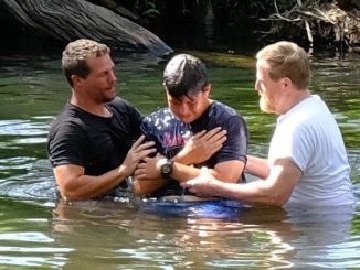 Matty with the help of a Now Church parishioner baptises a young church member at Darlington Park.