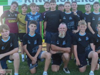 Coach Geoff Burr (centre) with the Division 1, U14 Kingfishers team