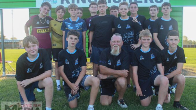 Coach Geoff Burr (centre) with the Division 1, U14 Kingfishers team