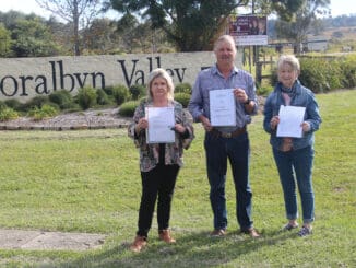 Sharon Rae, President of Kooralbyn Community Group Adrian Sandell and Lynne Carter