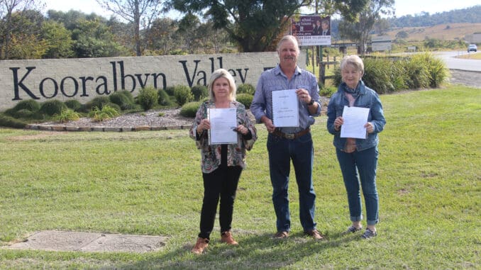 Sharon Rae, President of Kooralbyn Community Group Adrian Sandell and Lynne Carter