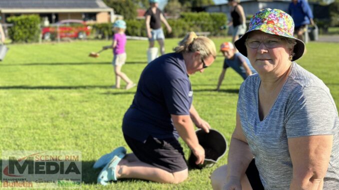 BDNA President Susan Wynne with volunteers repairing the netball grounds.