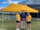 McAuley College used their Go For Gold funding grant to purchase four new sports house marquees. Principal Jason Pacey is pictured with Steele House captains, Emily Livingston and Olivia Cahill in front of their house marquee.