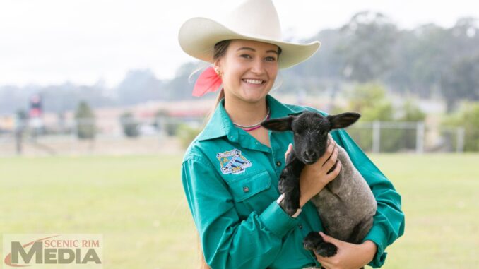 Layne Addy and Patrick the poddy lamb