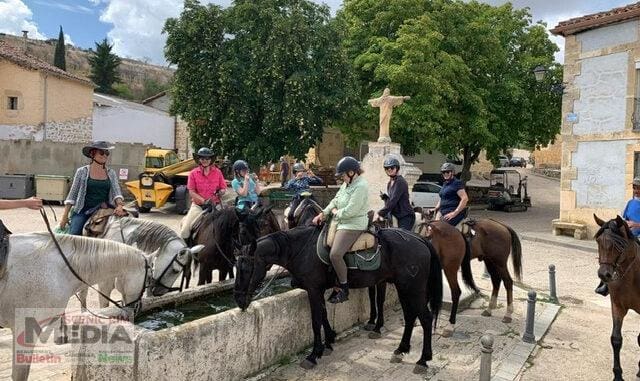 Riders stop in a Spanish town